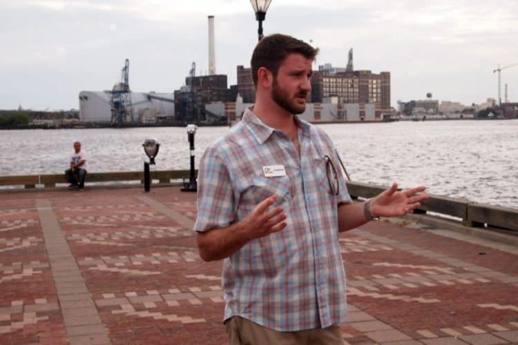 AJ Jensema, of Charm City Food Tours, shows off his city's food at Fells Point.