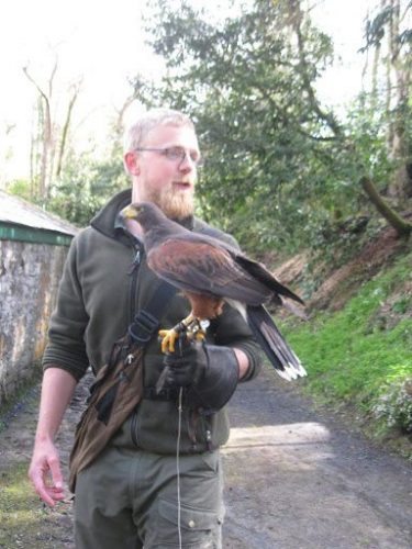 Ed introduces us to Dingle, the resident owl who may have been the inspiration for Brutus in Roberts' books photo courtesy of Ginger Warder