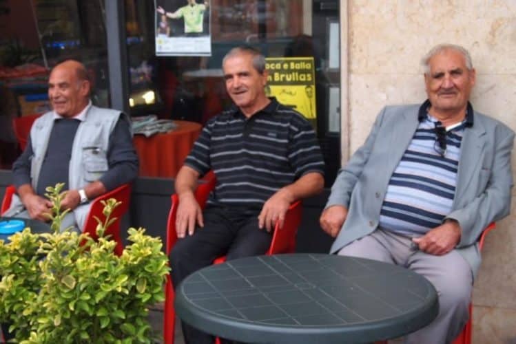 Men at a cafe in the morning in Cabras, Sardinia.