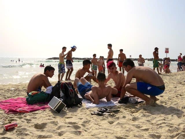 People gather at the beach in Tel Aviv. 