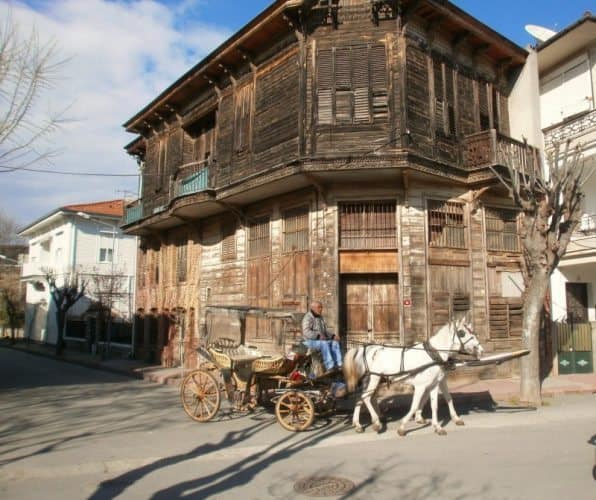 19th-century wooden mansion with feyton passing by on Buyukada