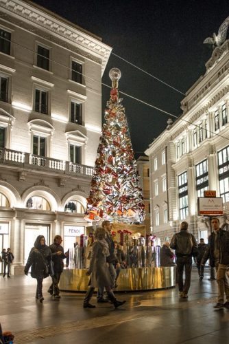 A tree made up entirely of purses in front of Fendi, the Italian luxury fashion house.