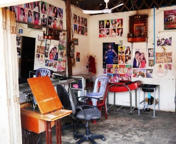 A local barber shop with celebrity hairstyles splashed throughout the walls.