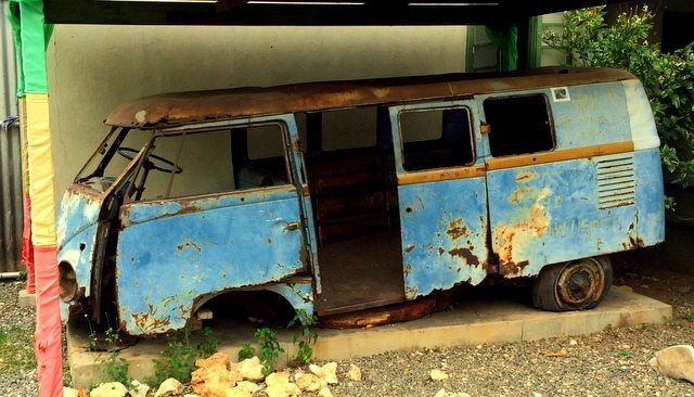 The rusting shell of Bob Marley's Volkswagen camper van in the courtyard of lower First Street in Trench Town, West Kingston, Jamaica.