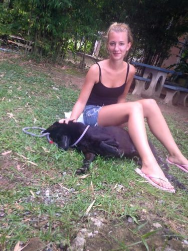 Lisa with a rescued dog in Thailand.