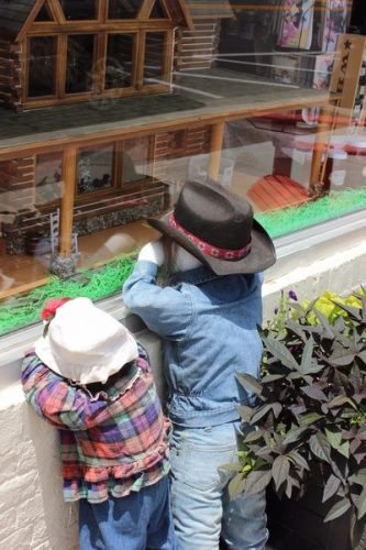Kids in doll shop window in Bardstown, Kentucky.