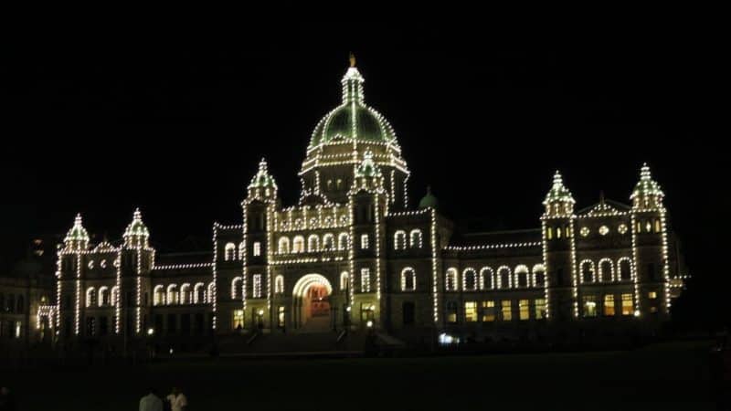 A lit up Legislative building in Victoria.