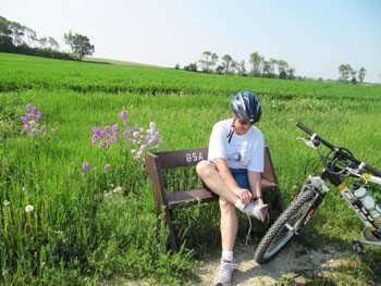 Rolling fields and a convenient bench make for a pleasant stop to remove stones from shoes or tires. 