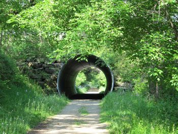 Near Lake Mills, an underpass beckons to riders to come in out of the heat. 