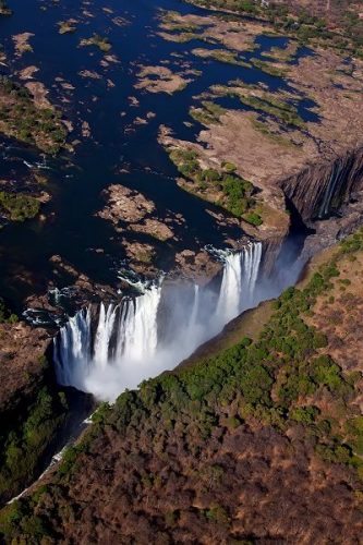 Aerial photograph of Victoria Falls, taken by an extremely courageous Jonathan Dale, who was leaning out of an open door of a helicopter to get this shot.