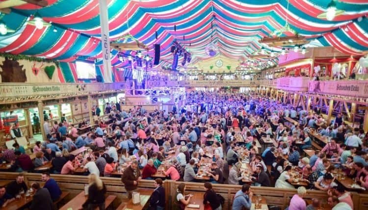 At the Volksfest in Stuttgart, there are tents with up to 5600 people inside, all drinking big tankards of beer.