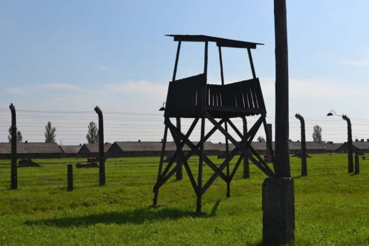 A crumbling watchtower at Auschwitz, once manned by Nazi guards.