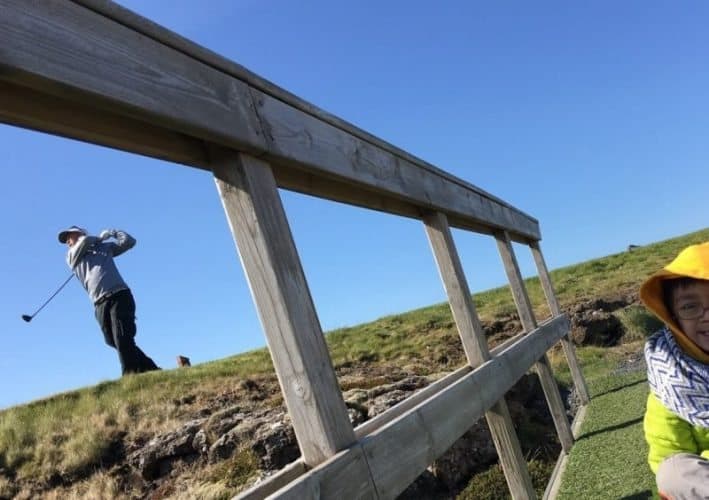 At the Grindavik Golf Course, a bridge helps golfers pass over a chasm in the earth where two tectonic plates are pulling away from each other. Golfers must tee off over the chasm.