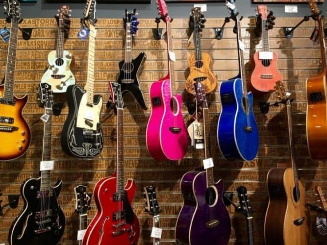 Guitars hang in an Austin music shop.