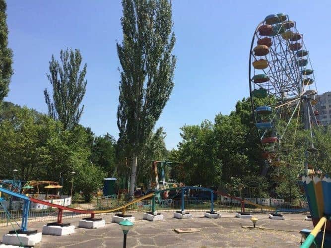 Ferris Wheels and rollercoasters, outside of Chisinau, Moldova.