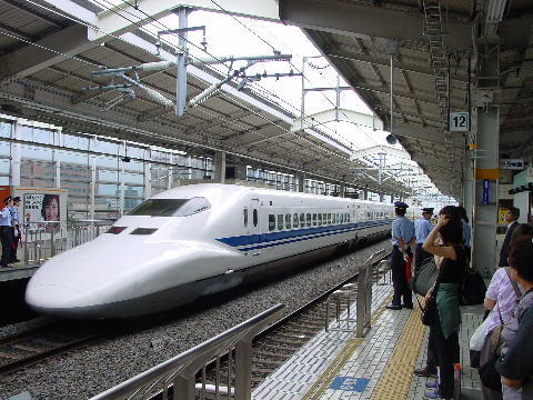 A Japanese Shinkansen, bullet train pulls into Tokyo station.