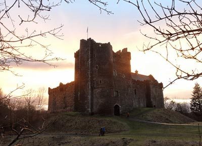 Doune Caste's mighty keep and courtyard wall, caught in a Highland sunset.