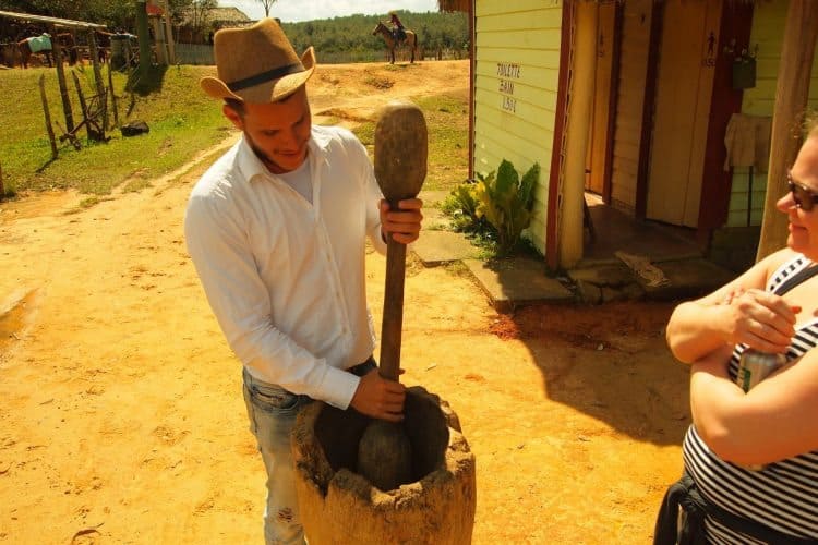 A farmer shows off his high tech coffee grinder in Vinales, Cuba.