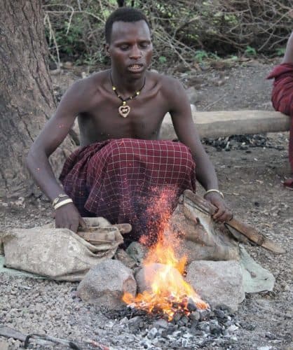 The handmade bellows create the intense heat needed to melt the scrap metal. Barbaig