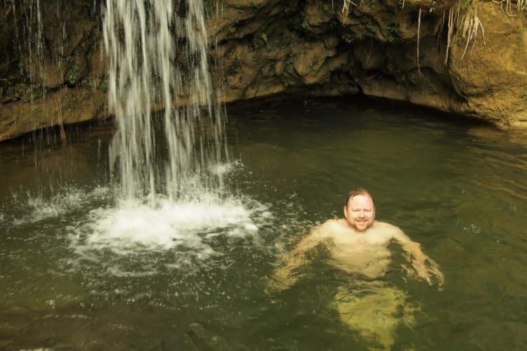 Enjoying a refreshing swim at a waterfall in Soroa, Cuba.
