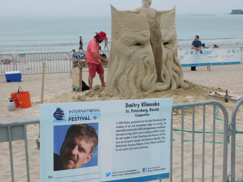 An artist working hard on his sculpture on Revere Beach.
