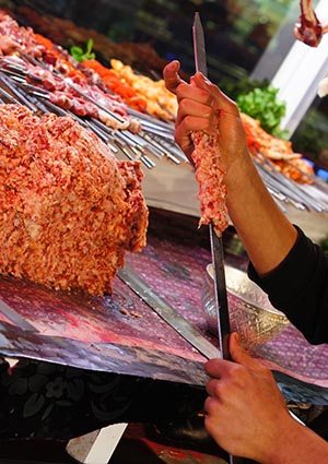 Kefta is ground lamb with onions and spices, served on a big slab that's sliced off for each customer.