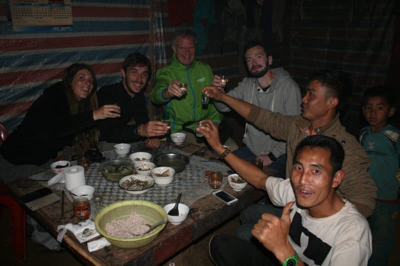 The gang drinking lao-lao in Penyenxang village. Boss is second from right.