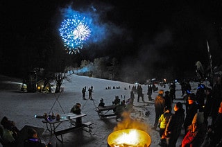 Fireworks at an event at King Pine Ski Area make for a lovely winter setting. Photo courtesy of Purity Spring Resort