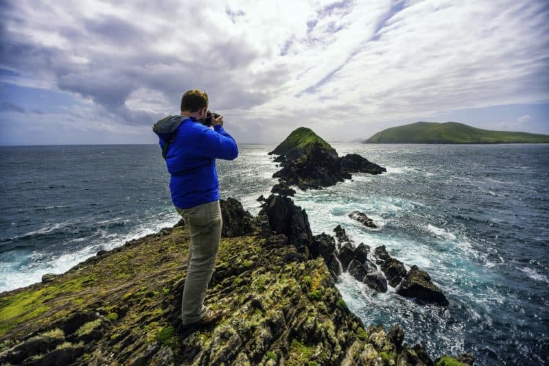 The author, Andy Castillo, taking pictures on the coast of the Dingle Peninsula. Image by Andres Dario Moral Neumane.