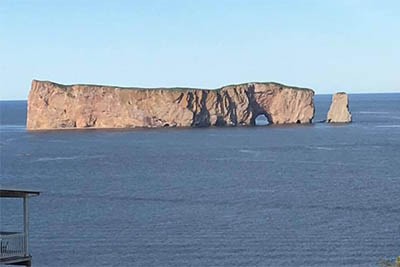 Perce Rock stands just off the coast of Perce, and adjacent to Bonaventure Island, where thousands of gannets nest every year.