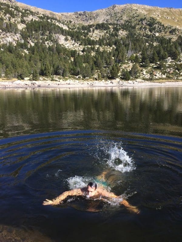 The author takes an icy mountain lake dip near Ger in the Girona province.