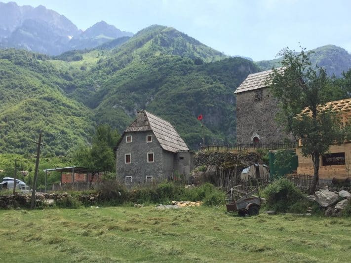 Old mills in the center of Theth, with the Albanian Alps in the background.