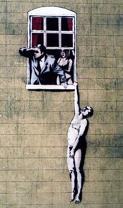 This original Banksy was partly vandalized by rival artists, but you can still see it on the side of a building downtown.