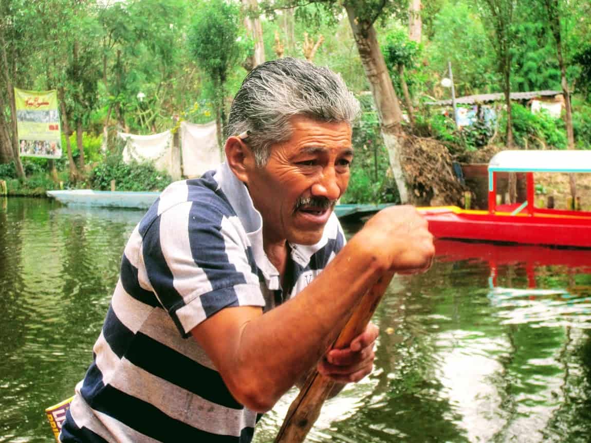 A picture of concentration, our boatman - Xochimilco, Mexico