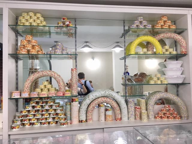 A fancy display of containers in a gelato place in Assisi -- not one of the ones approved by Marco. Photo by Ann Banks.