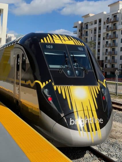 Locomotive 103 propels the sleek trainset Brightline is now operating in Florida.