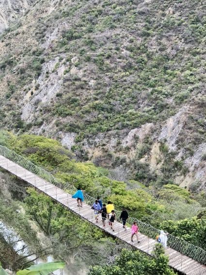 Hiking across the suspension bridge at Tolantongo. A walk for those who do not fear heights! | GoNOMAD Travel