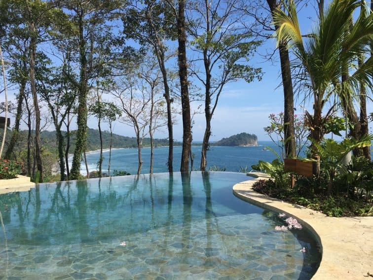 Arenas del Mar infinity pool overlooking the public and park beaches of Manuel Antonio.