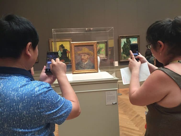People take smartphone photos of a van Gogh painting at the Metropolitan Museum of Art in New York City. Sarah Eddy photos.