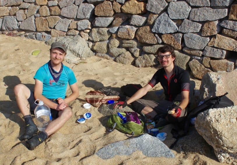 Raphael (left) and Felix enjoy a hard-earned breakfast of peanut butter, nutella and yogurt during before continuing their bicycle tour from Portugal to Greece.