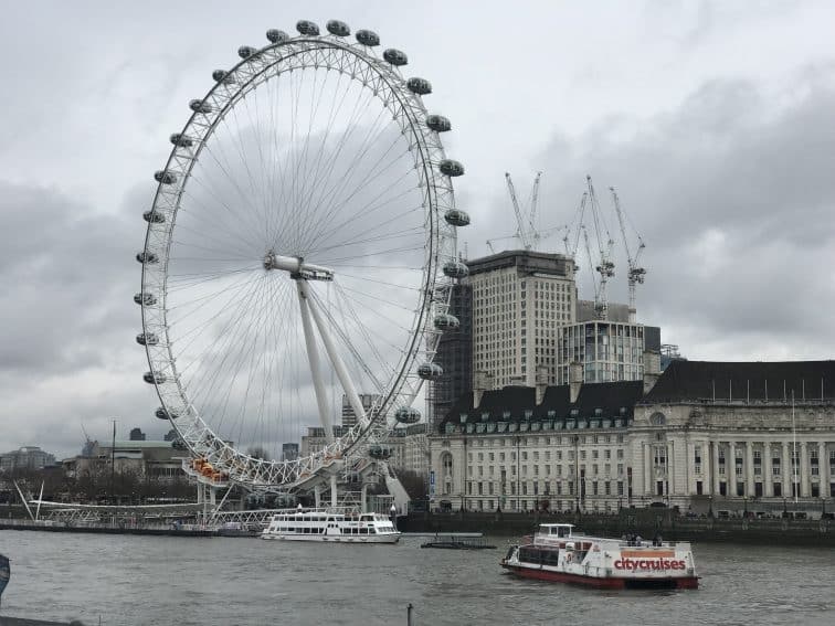 The London Eye amongst the city's classically grey skies. 