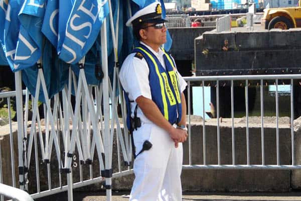 Cruise ship security at his post. Cruise Ships keep many employees busy as guards to keep everyone safe.