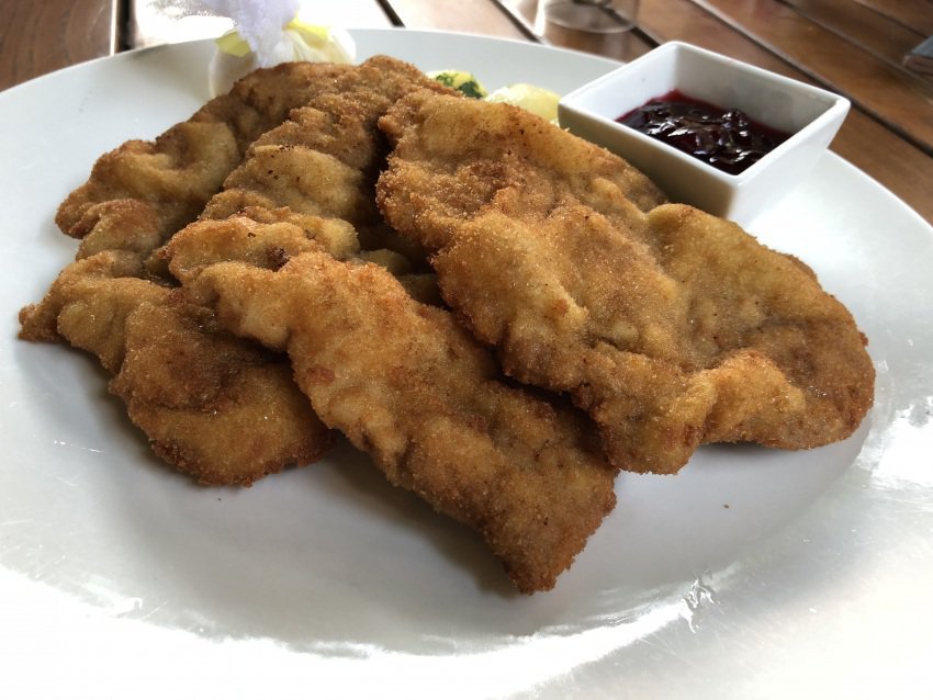 Wienerschnitzel, the famous dish of Austria, served with jelly at the Adler Restaurant in Schwarzenberg.