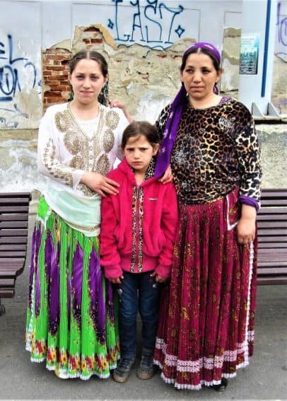 Romanian Roma woman posing for pocket change in Brasov.