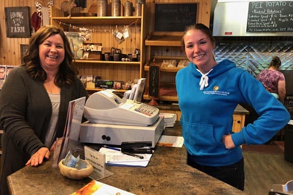 At the Canadian Potato Museum in O'Leary, Donna Rowley, left, served lobster-stuffed spuds along with an extensive history of the potato.