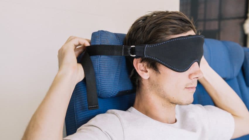 Seatdreamzzz mask that connects to the headrest to keep your head straight.