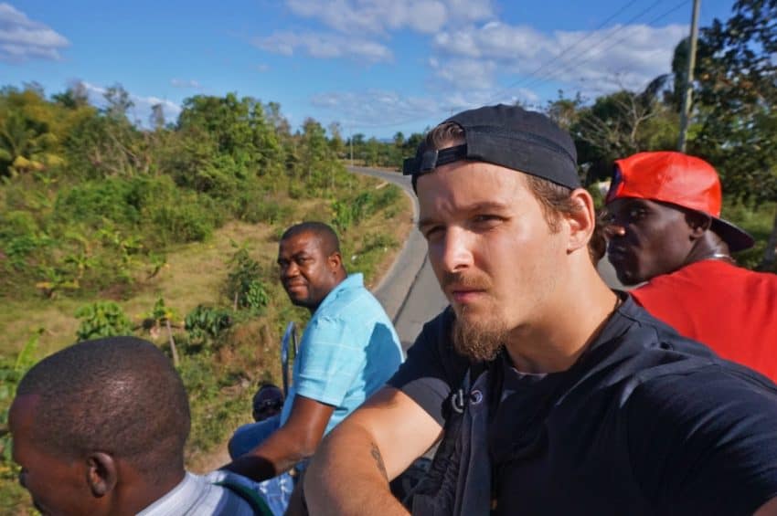 Yuri on the top of a city bus in Haiti, before being removed.