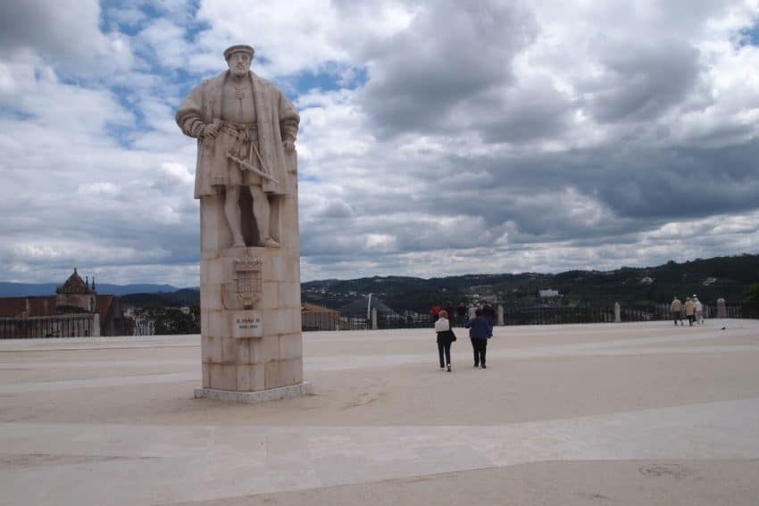 The University of Coimbra is famous for this huge square with the imposing statue of King Joao III in the middle. Max Hartshorne photo.