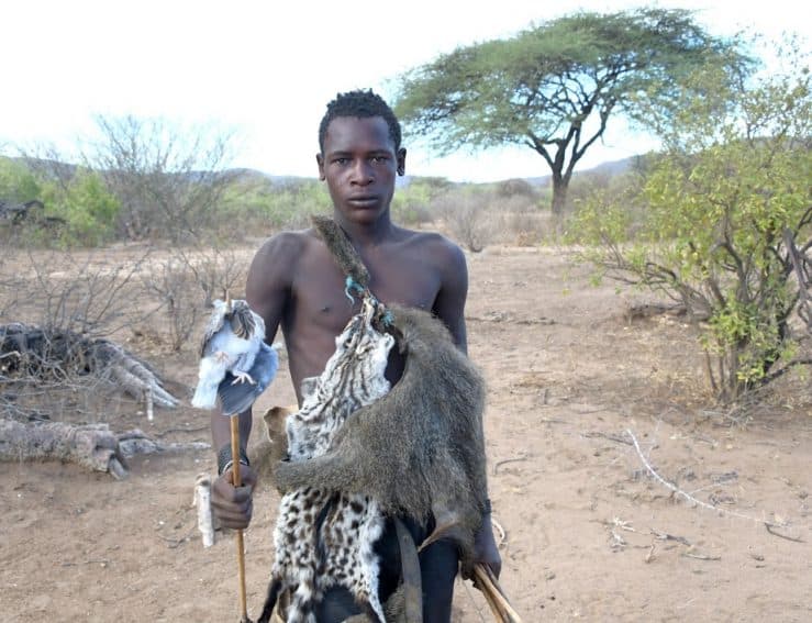 A Hadzabe hunter with his bowed bird in Tanzania.