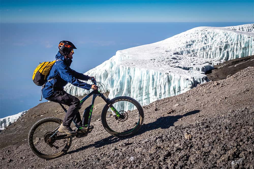 With the e-Bike on almost 6000 meters at Kilimanjaro in Africa